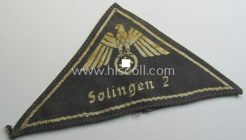 Attractive, German Red Cross (ie. 'Deutsches Rotes Kreuz' or 'DRK') related, EM- (ie. NCO-) type, greyish-coloured- and/or (typically) triangular-shaped arm-eagle as executed in the neat 'BeVo'-weave pattern entitled: 'Solingen 2'
