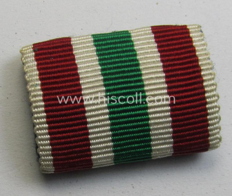 Single-pieced - and actually scarcely found! - WH (Heeres, LW etc.) ribbon-bar (ie. 'Band- o. Feldspange') showing the ribbon for a WH Memel- (ie. 'Memelland'-) 'Anschluss'- (ie. occupation-) medal: '22 März 1939'