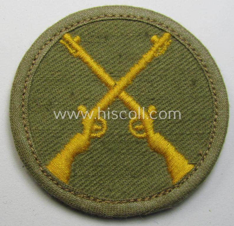 WH (Heeres) 'tropical'-issue, trade- and/or special-career insignia (ie. machine-embroidered 'Laufbahn- o. Tätigkeitsabzeichen') as was intended for an army: 'Waffenmeister' (or weapon-equipment NCO)
