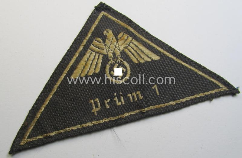 Attractive, German Red Cross (ie. 'Deutsches Rotes Kreuz' or 'DRK') related, EM- (ie. NCO-) type, greyish-coloured- and/or (typically) triangular-shaped arm-eagle as executed in the neat 'BeVo'-weave pattern entitled: 'Prüm 1'