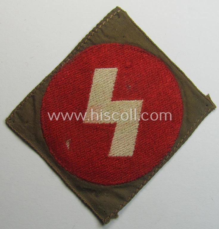 Truly used, DJ (ie. 'Deutsches Jungvolk') arm-badge as was specifically intended for usage by a member who served within the: 'Oberbann 1' (being a tunic-removed example that is void of an 'RzM'-etiket)