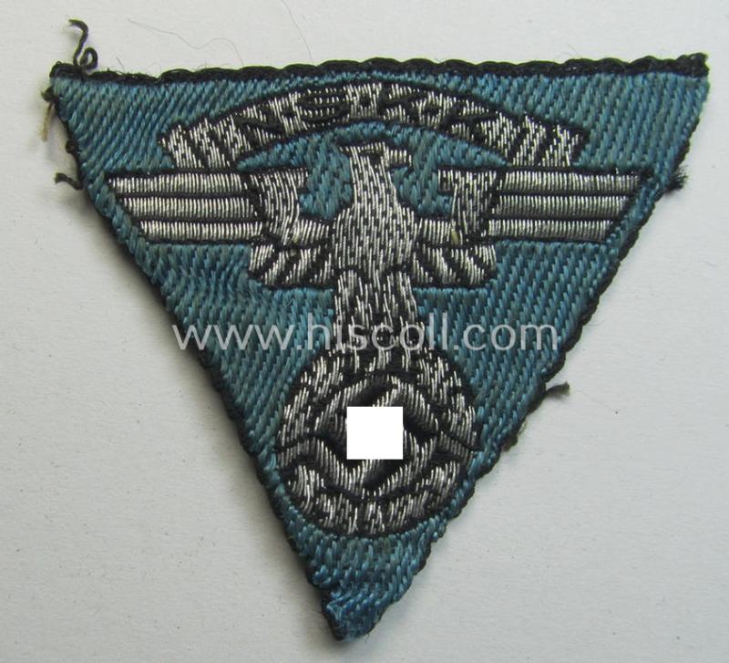 Neat - and clearly used! - so-called: N.S.K.K. (ie. 'National Socialistisches Kraftfahr Korps') side-cap-eagle (ie. 'Adler für N.S.K.K.-Schiffchen o. Lagermütze') being a 'flat-wire-woven'-example onto a bright-blue-coloured background