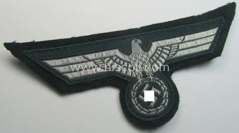 WH (Heeres) breast-eagle as executed in 'BeVo'-type-, so-called: 'flat-wire'-weave-pattern and pre-mounted on darker-green-coloured wool as was specifically intended for usage by soldiers (ie. NCOs) on their dress-tunics (ie. 'Waffenröcke')