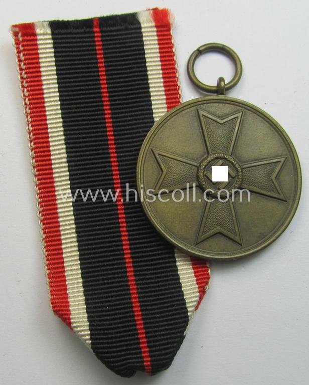Neat, 'Kriegsverdienstmedaille 1939' being a non-maker-marked- (and/or: 'Buntmetall'-based) specimen that came together with its full-length (bright-red-coloured) ribbon (ie. 'Bandabschnitt')