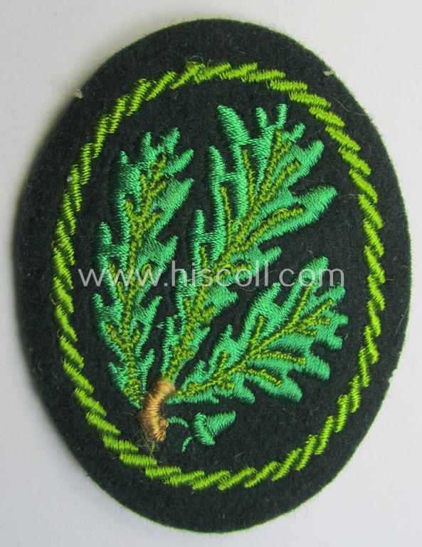 Attractive example of a WH (Heeres) so-called: 'Jäger'-armbadge being a neatly machine-embroidered- and/or multi-coloured version as was executed on darker-green-coloured wool