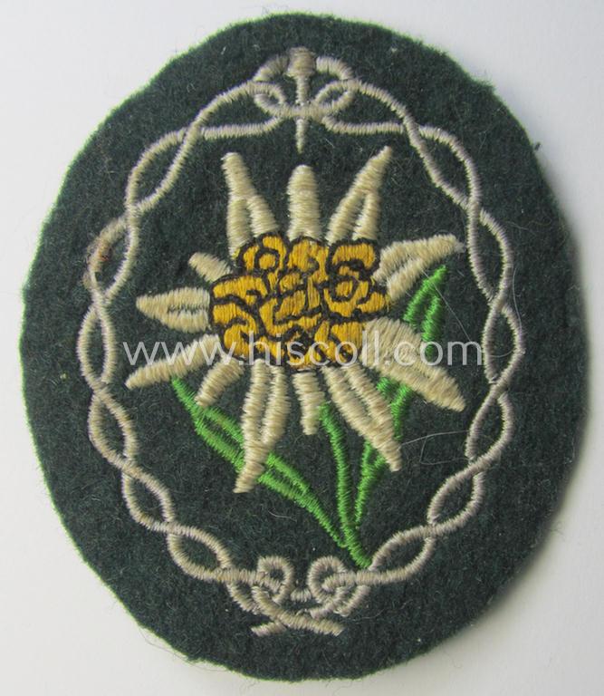 Attractive - and 'virtually mint'! - WH (Heeres) EM- (ie. NCO-) type 'Edelweiss'-armpatch being a machine-embroidered example as was executed on darker-green wool as was intended for usage by the: 'Gebirgsjäger-Truppen' throughout the war