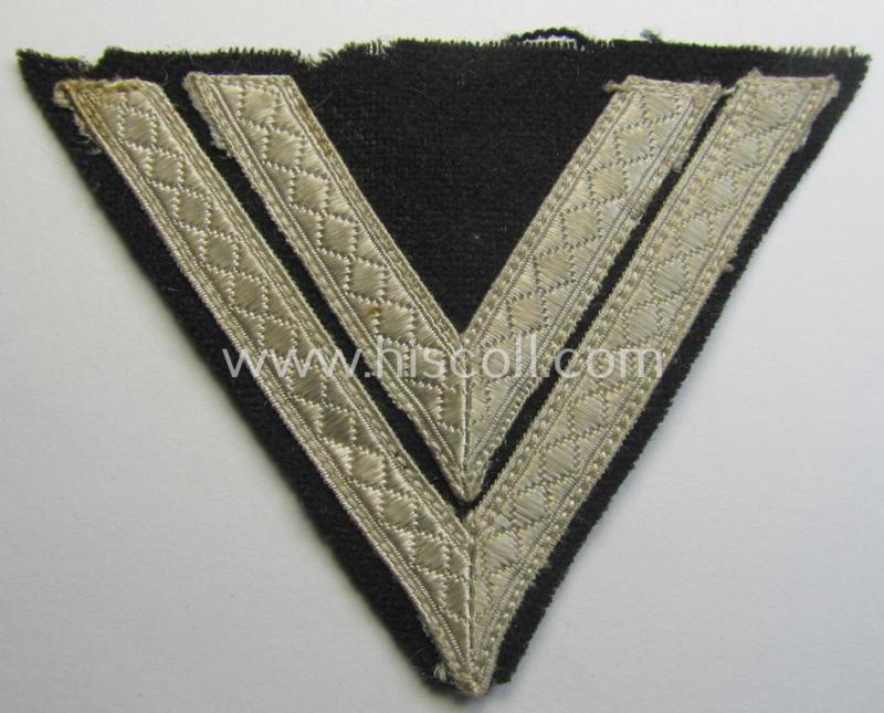 Neat - and just moderately used! - Waffen-SS- (ie. Heeres Panzer-) type 'Armwinkel' (or: rank-chevron) as executed on black-coloured wool as was intended for an: 'SS-Rottenführer' (ie. 'Obergefreiter')