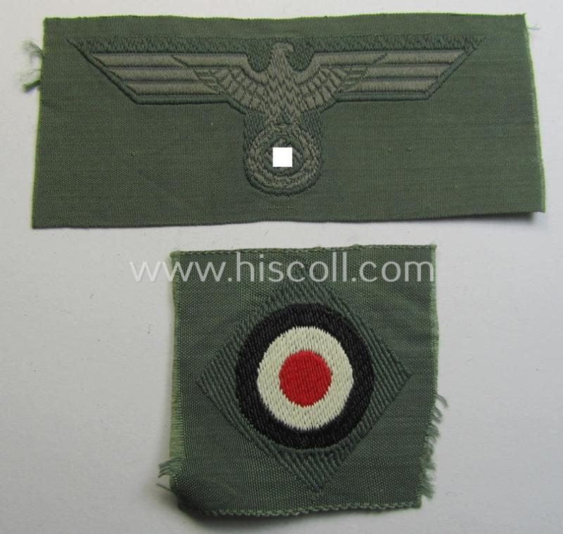 Early- (ie. mid-) war-period, WH (Heeres) cap-eagle & cocarde-set (ie. 'Schiffchenmützen-Adler u. Kokarde für Mannschaften u. Uffz.') being a 'virtually mint' set as executed in bluish-grey-coloured linnen on a field-grey-coloured background