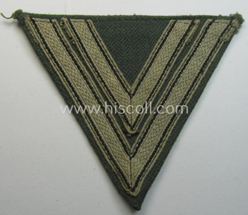 Attractive, WH (Heeres ie. Waffen-SS) 'Armwinkel' (or: arm-chevron) as was executed on a greenish-coloured- and/or 'HBT'-like (ie. 'Drillich'-) based background as was specifically intended for an: 'Obergefreiter' (ie. 'SS-Rottenführer')
