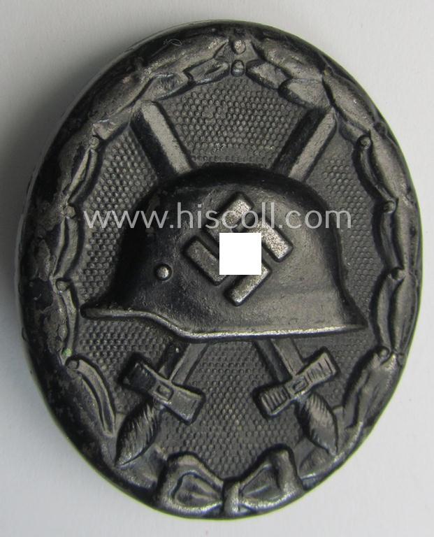 Neat, dual-maker- (ie. 'E.H.'- and/or: '126'-) marked example of a black-class wound-badge (or: 'Verwundeten-Abzeichen in Schwarz') being an example that was produced by the maker (ie. 'Hersteller') named: 'Eduard Hahn'
