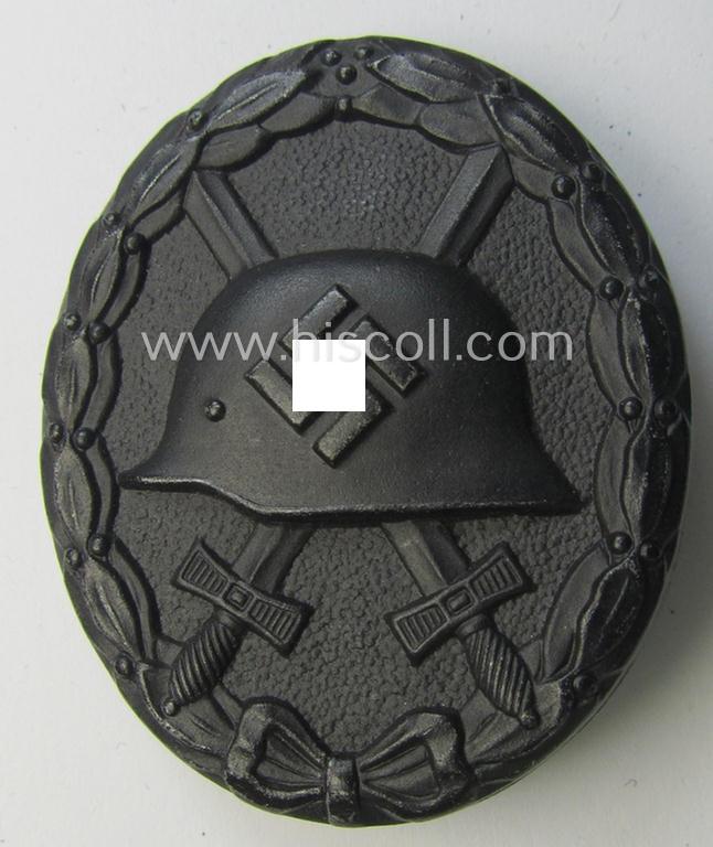 Superb, neatly maker- (ie. 'A'-) marked example of a black-class wound-badge (or: 'Verwundeten-Abzeichen in Schwarz') being an example that was produced by the maker (ie. 'Hersteller') 'Assmann & Söhne'