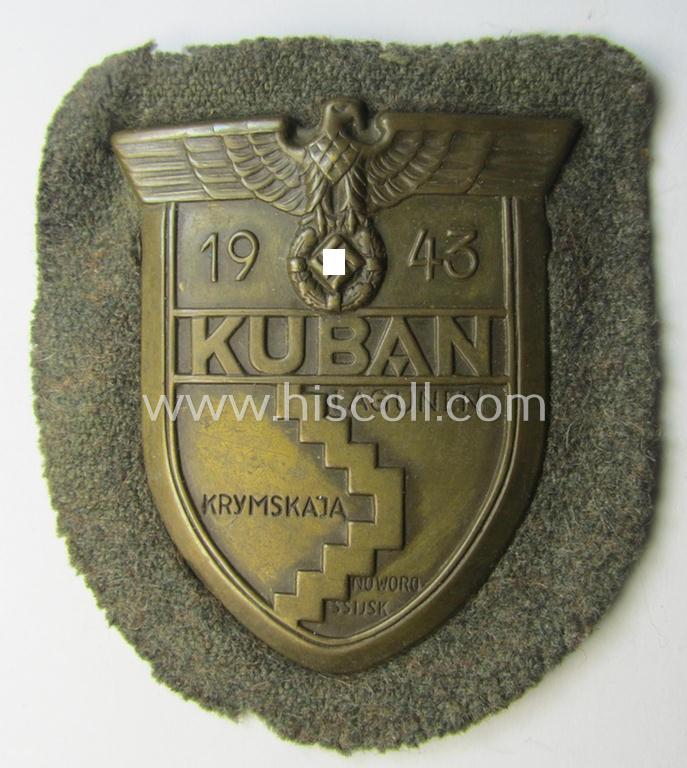 Attractive - truly worn and actually scarcely encountered! - WH (Heeres ie. Waffen-SS) 'Kuban'-campaign-shield that comes mounted onto its original field-grey-coloured- and/or woolen-based 'backing' as issued and/or used