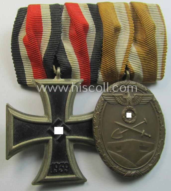 Superb - and truly very nicely preserved! - two-pieced medal-bar (ie. 'Ordenspange') showing resp. an: 'Eisernes Kreuz II. Kl.' (of the 'Schinkel'-pattern!) and a: 'Westwall'-medal that come period-mounted as a: 'Doppelspange'