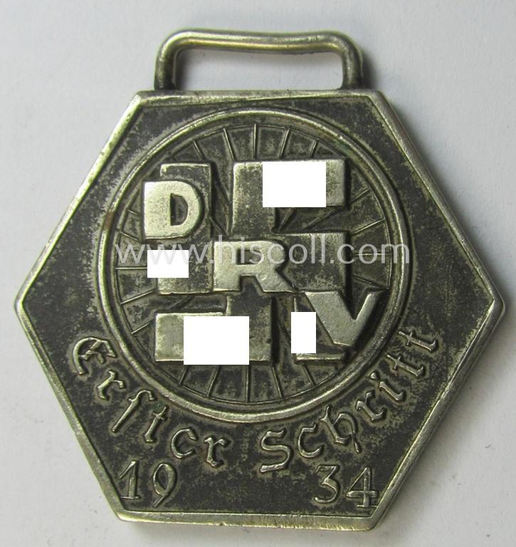 Attractive - and truly very detailed! - silver-toned so-called: 'Deutscher Radfahrer Verbandes'- (ie. D.R.V.-) related bicycle-contest-related award depicting the text: 'D.R.V. Erster Schritt 1934 - 5. Preis der Zwisschen-Entscheidung - Gau III'