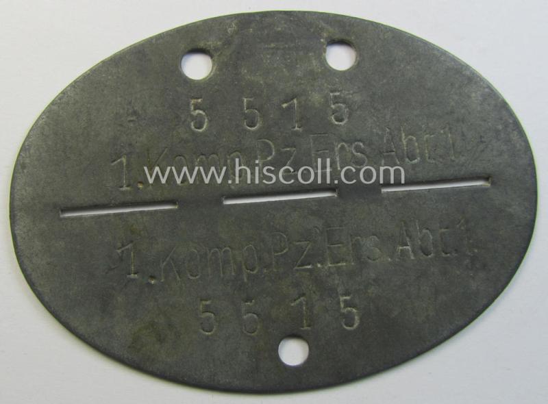 Superb - and scarcely found! - typical zinc-based, WH (Heeres-) ie. 'Panzer'-related ID-disc (ie. 'Erkennungsmarke') bearing the clearly stamped unit-designation that reads: '1.Komp.Pz.Ers.Abt.1' and that comes as issued and/or worn