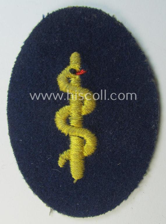 Attractive - and scarcely found! - HJ (ie. 'Hitlerjugend') trade- or specialist-armbadge (of the second pattern) as executed on blue-toned wool as was intended for usage by a: 'Feldscher' (or: medical orderly)