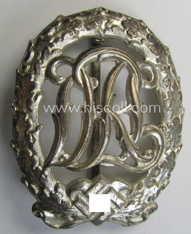 Attractive - and I deem just moderately worn- ie. used! - 'Reichssportabzeichen DRL in Silber' (or: DRL sports'-badge in silver) being an example that is nicely maker- (ie. 'Wernstein - Jena'-) marked on its back