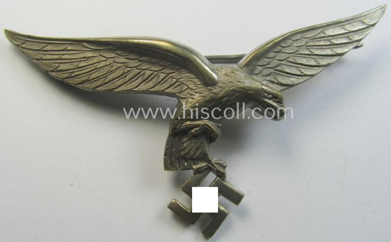 Superb - and rarely encountered! - WH (Luftwaffe) 'Buntmetall'-based breast-eagle as intended for usage on the white summer-tunics, being a very detailed (albeit non-maker-marked-) specimen showing an early-pattern, 'down-tailed' eagle