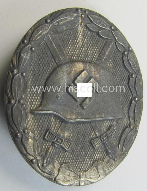 Attractive - and moderately used- and worn! - example of a maker- (ie. '65'-) marked example of a silver-class wound-badge (or: 'Verwundeten-Abzeichen in Silber') as was produced by the 'Hersteller' ie. maker: 'Klein u. Quenzer'