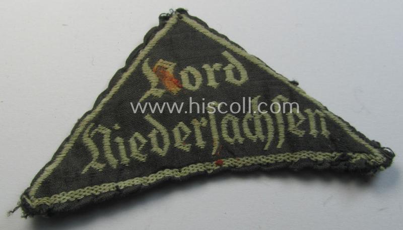 HJ/BDM ('Hitlerjugend' ie.: 'Bund Deutscher Mädel') district-triangle (ie. 'Gebietsdreieck') being an example that misses its 'RzM-etiket' and that is entitled: 'Nord Niedersachsen' and that comes in a clearly tunic- ie. shirt-removed, condition