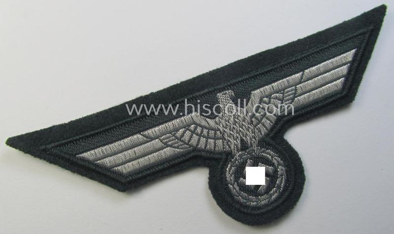 WH (Heeres) breast-eagle as executed in 'BeVo'-type-, so-called: 'flat-wire'-weave-pattern and pre-mounted on darker-green-coloured wool as was specifically intended for usage by soldiers (ie. NCOs) on their dress-tunics (ie. 'Waffenröcke')
