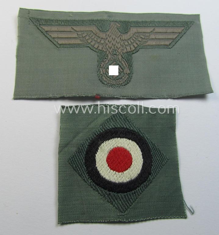 Early- (ie. mid-) war-period, WH (Heeres) cap-eagle & cocarde-set (ie. 'Schiffchenmützen-Adler u. Kokarde für Mannschaften u. Uffz.') being a 'virtually mint' set as executed in bluish-grey-coloured linnen on a field-grey-coloured background