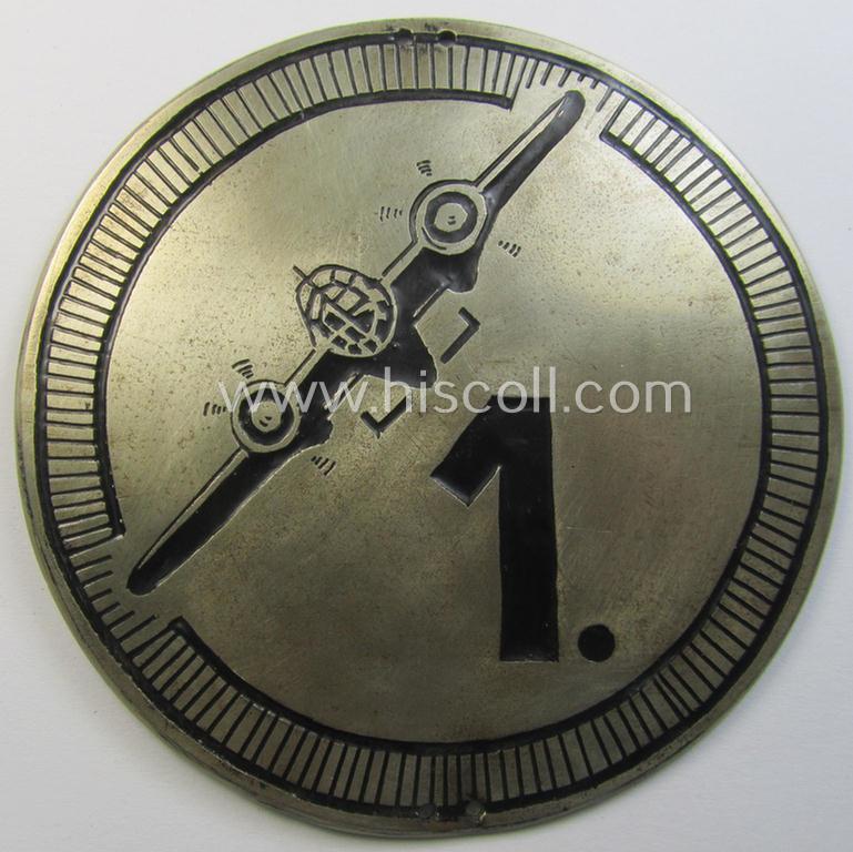 Attractive - quite detailed and possibly unique! - silverish-golden-coloured (and I deem 'Buntmetall'-based!) so-called commemorative 'plaque' showing the silhouette of a German bomber-plane coupled with a '1'-numeral (presumably 'Geschwader 1')