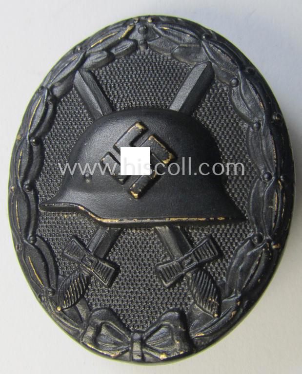 Attractive - and moderately used - neatly maker- (ie. 'L/54'-) marked example of a black-class wound-badge (or: 'Verwundeten-Abzeichen in Schwarz') being an example that was produced by the maker (ie. 'Hersteller') named: 'Schauerte u. Höhfeld'