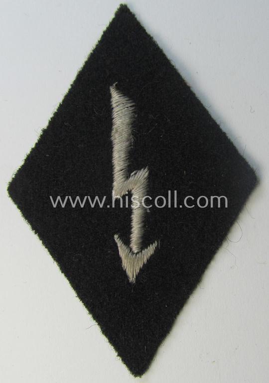 Neat, Waffen-SS-pattern-, machine-embroidered and black-coloured sleeve-insignia (ie. 'Ärmelraute') depicting a so-called: 'Signalblitz', as was used and intended to signify membership within a: 'Waffen-SS Nachrichten'-unit