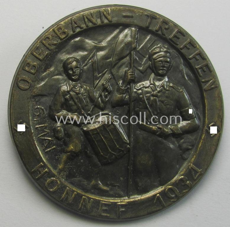 Superb - and scarcely encountered! - HJ- (ie.'Hitlerjugend') related 'tinnie' being a golden-bronze-toned- and nicely maker- (ie. 'Hofstätter'-) marked example showing two 'HJ-Mitglieder' and text: 'Oberbann-Treffen - Honnef - 1934'