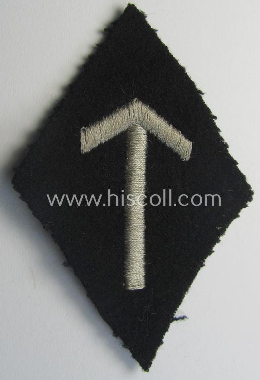 SS-pattern sleeve-insignia (ie. 'Ärmelraute') depicting a: 'Tyr'-rune signifying membership within the: 'Ergänzung, Erfassung u. Schulungswesen' within the: 'SS'