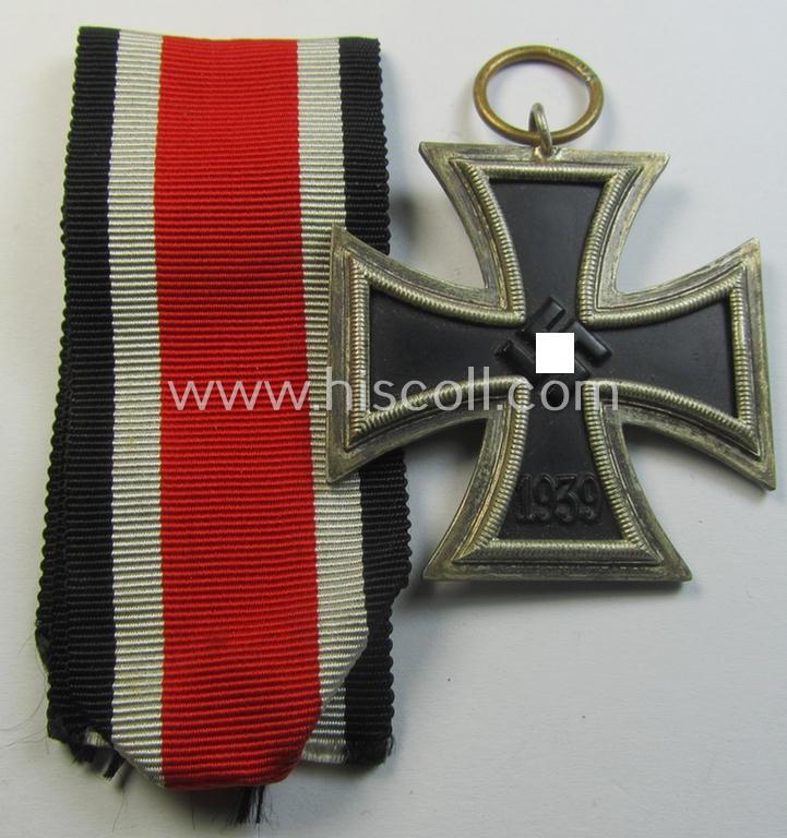 Attractive, 'Eisernes Kreuz II. Klasse' being a maker- (ie. '120'-) marked example that comes together with its original- and once-mounted ribbon (ie. 'Bandabschnitt') as was produced by the Austrian-based maker (ie. 'Hersteller'): 'Franz Petzl'