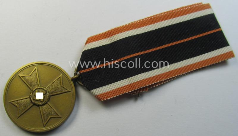 Neat, 'Kriegsverdienstmedaille 1939' being a non-maker-marked- (and/or: 'Buntmetall'-based) specimen that came mounted onto its full-length (truly orange-red-coloured!) ribbon (ie. 'Bandabschnitt')