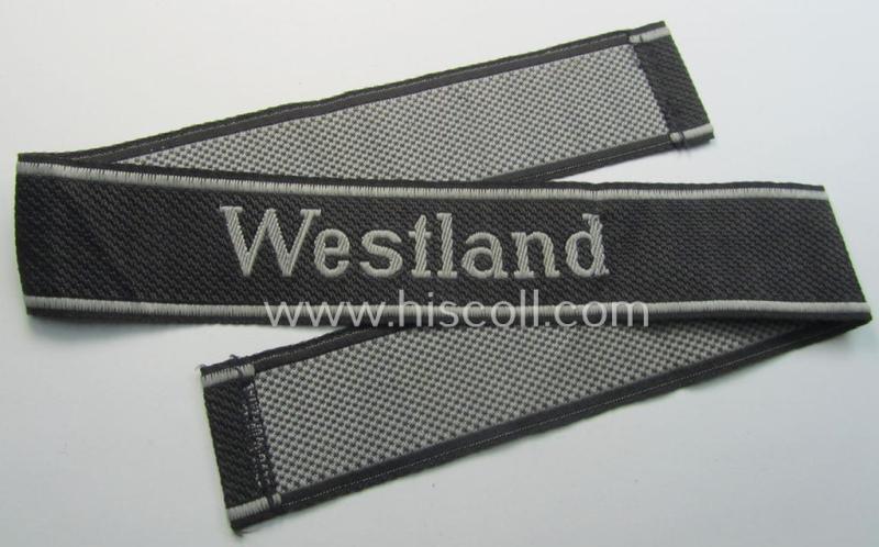 Waffen-SS, 1943/44 pattern cuff-title (ie. 'Ärmelstreifen') depicting the machine-woven Latin script text in silver-grey linnen as was intended for a member of the: 'SS-Regiment 