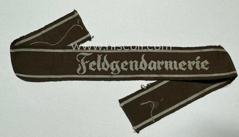 WH (Heeres) cuff-title ie. armband (ie. 'Ärmelstreifen') entitled: 'Feldgendarmerie' (being a typical 'semi-BeVo'-woven example)