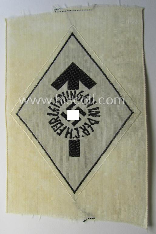 HJ- (ie. 'Hitlerjugend') 'Leistungsabzeichen in Schwarz in Stoff' that retains its 'RzM'-etiket