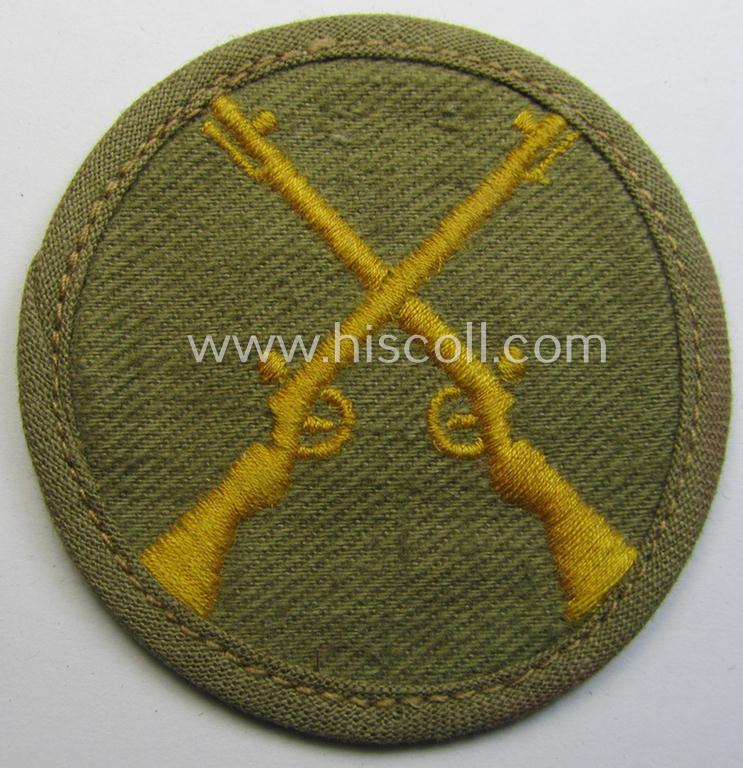 WH (Heeres) 'tropical'-issued, trade- and/or special-career insignia (ie. machine-embroidered 'Laufbahn- o. Tätigkeitsabzeichen') as was intended for an army: 'Waffenmeister' (or weapon-equipment NCO)