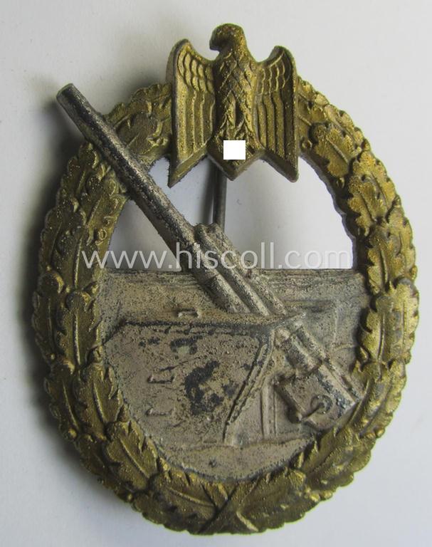 WH (KM) 'Marine-Artillerie-Abzeichen' being a maker- (ie. 'F.L.L. - 43'-) marked- and/or zinc- (ie. 'Feinzink'-) based example by the: 'Friedrich Linden'-company