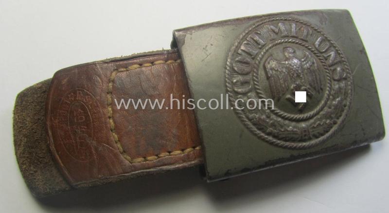 Moderately used, 'standard-issue'-pattern, WH (Heeres) field-grey-toned- and steel-based belt-buckle being a maker- (ie. 'R.S.&S.'-) marked example that comes mounted onto its 'R. Sieper u. Söhne'-marked and/or '1940'-dated tab