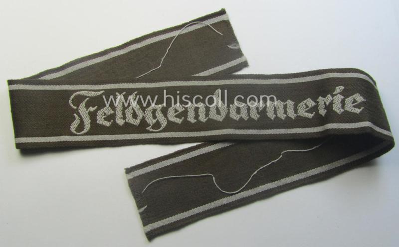 WH (Heeres) cuff-title ie. armband (ie. 'Ärmelstreifen') entitled: 'Feldgendarmerie' (being a typical 'semi-BeVo'-woven example)