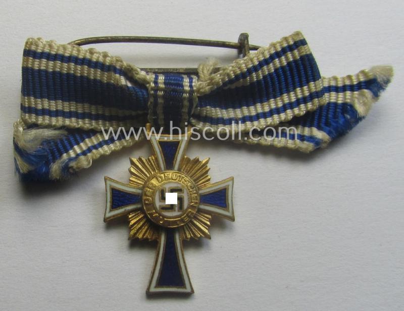 Miniature of an: 'Ehrenkreuz der deutschen Mutter - erste Stufe' (or: golden-class mothers'-cross) being a non-maker-marked example that comes in an overall nice- (albeit moderately worn- ie. used-), condition