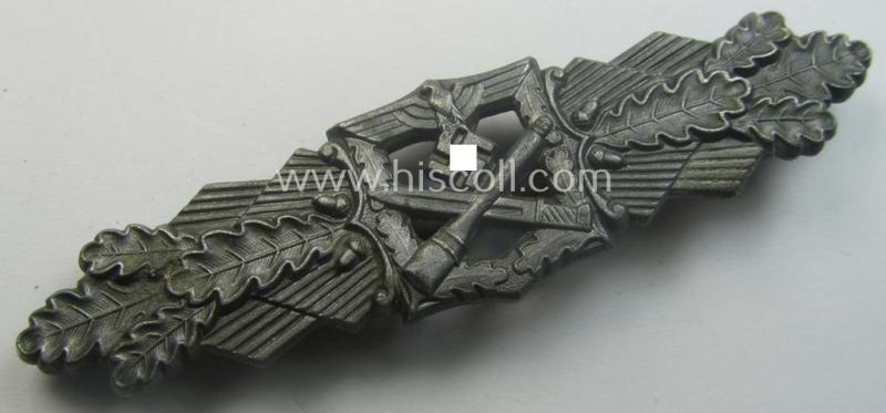'Nahkampfspange in Bronze' (or: bronze-class close-combat clasp ie. CCC) being a maker- (ie. 'FLL'-) marked- and minimally converse-shaped so-called: '3rd pattern'-specimen as was produced by the maker- (ie. 'Hersteller') 'Friedrich Linden'