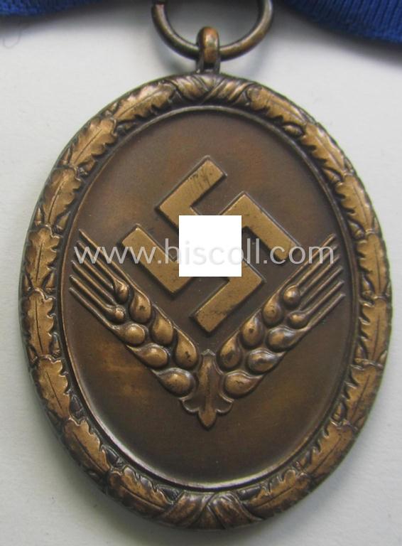 Scarcely encountered example of a: 'Reichsarbeitsdienst der weiblichen Jugend' (or: RADwJ) so-called: 'Dienstauszeichnung der 4. Stf. in Bronze' that comes mounted onto its period ('bow-tie'-shaped) ribbon (ie. 'Bandabschnitt')