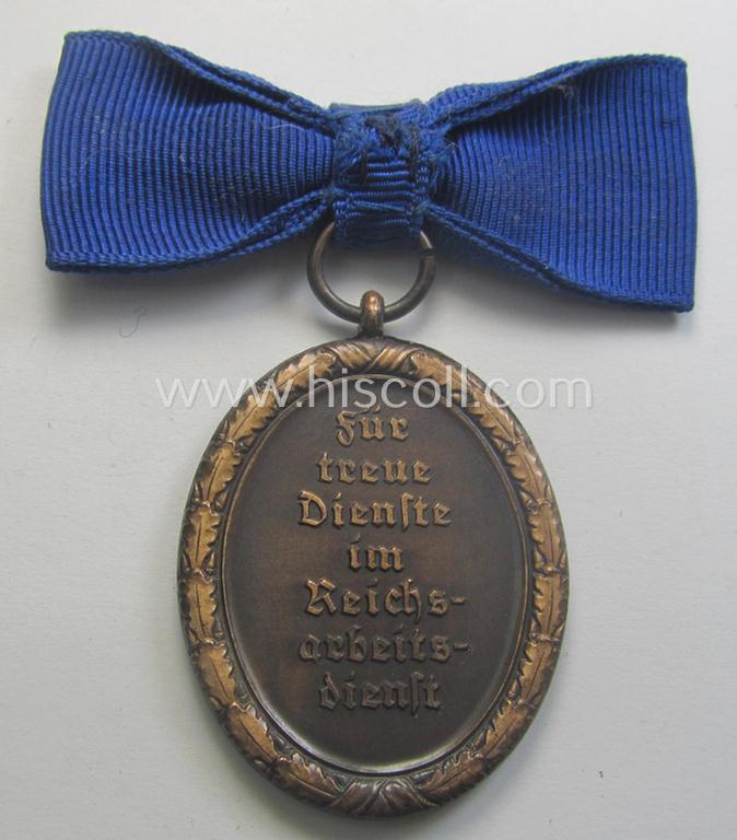Scarcely encountered example of a: 'Reichsarbeitsdienst der weiblichen Jugend' (or: RADwJ) so-called: 'Dienstauszeichnung der 4. Stf. in Bronze' that comes mounted onto its period ('bow-tie'-shaped) ribbon (ie. 'Bandabschnitt')