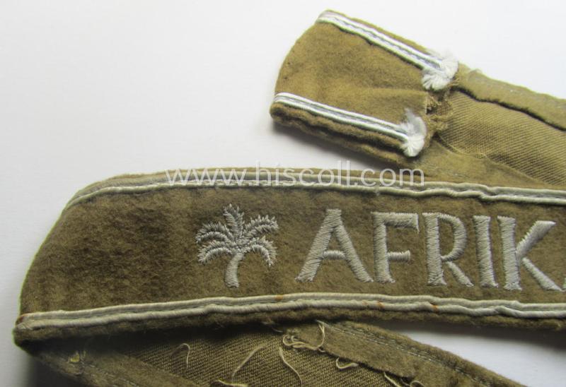 Moderately used, WH cuff-title (ie. 'Ärmelstreifen') entitled: 'Afrika' (being a hardly shortened example that comes in an overall very nice- (ie. issued and clearly worn ie. once tunic-attached-), condition