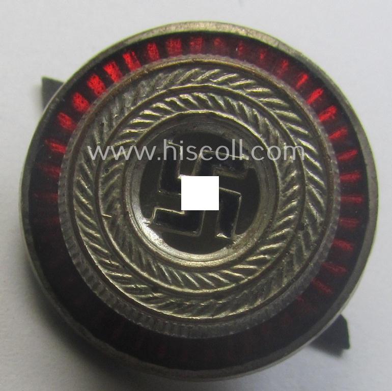 Political-style- (ie. N.S.D.A.P.-related-) multi-pieced visor- (ie. 'Schirmmützen'-) cap-cocarde which is neatly: 'RzM' and/or 'M1/34' marked on its back