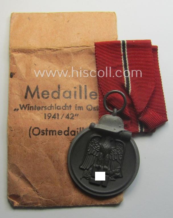Fully matching medal-set: 'Winterschlacht im Osten 1941/42' as produced by the: 'Foerster & Barth'-company being a clearly maker- (ie. '10'-marked) specimen that came stored in its original 'Zellstoff'-based pouch of issue as found