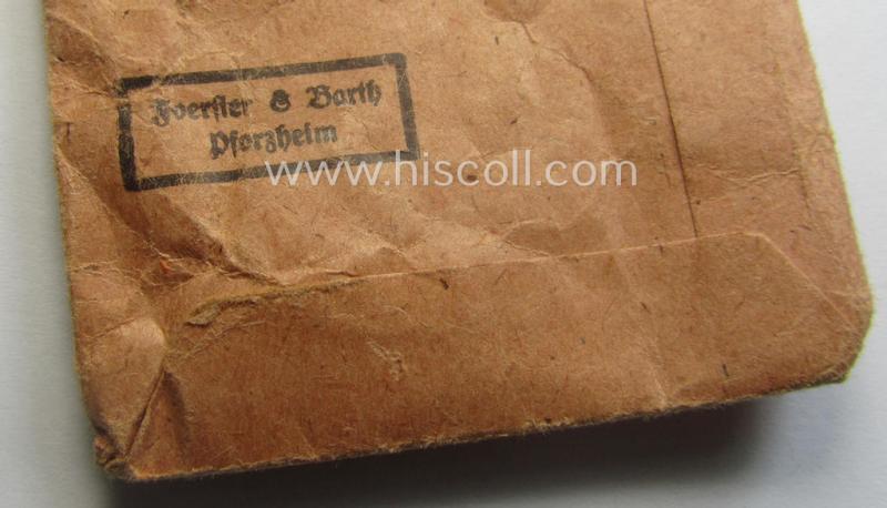 Fully matching medal-set: 'Winterschlacht im Osten 1941/42' as produced by the: 'Foerster & Barth'-company being a clearly maker- (ie. '10'-marked) specimen that came stored in its original 'Zellstoff'-based pouch of issue as found