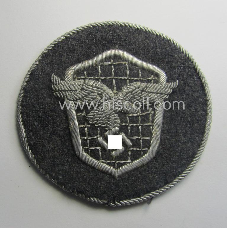 Superb - and actually rarely encountered! - example of a WH (Luftwaffe) neatly hand-embroidered, trade- ie. special-career-patch (ie. 'Tätigkeitsabzeichen') having a silverish-grey-toned 'Kordel' attached as was intended for: 'LW-Kraftfahrpersonal'