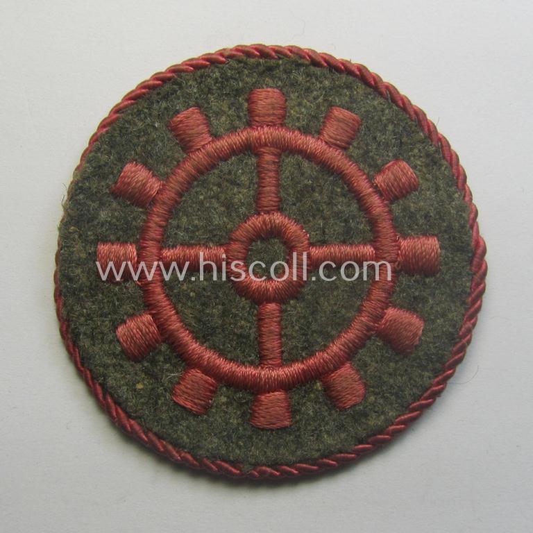 WH (Heeres ie. 'Panzer'-) machine-embroidered-, trade- ie. special-career patch, having a not that often encountered (bright-pink-coloured) 'Kordel' (ie. 'Umrandung') attached, as was intended for a: 'Panzerwarte o. Kfz.-Warte der I. Kl.'